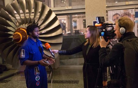 Man being interviews by TV crew