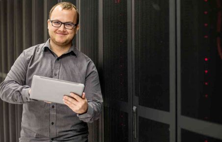 man holding a laptop