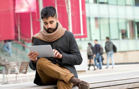 Man looking at a tablet