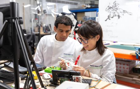 Female student and lecturer in laboratory