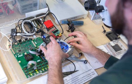 man building a hard drive computer