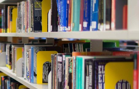 Library shelf of books publications