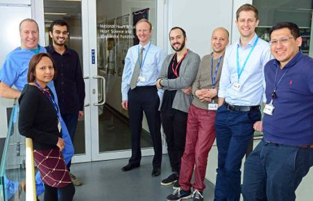 Researchers stand in hallway