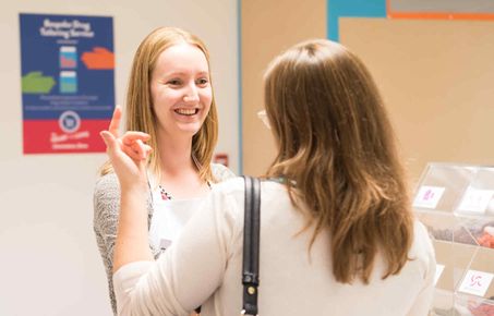 Researcher talks to member of public