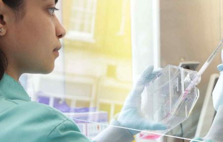 Student in the lab with syringe