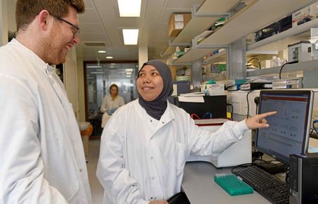 students talk in lab