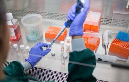 Researcher in the lab with pipette
