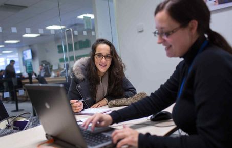 A student receiving advice in the Student Hub