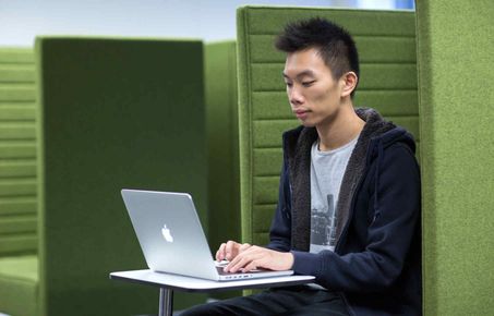 Student working alone on a laptop