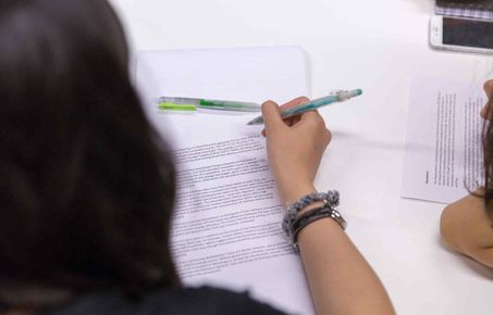 Student reading during a workshop