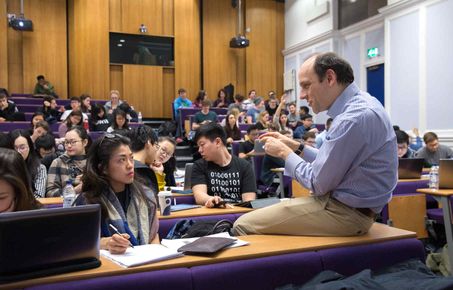 Lecturer interacting with student