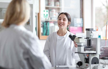 Student receiving feedback in a lab setting