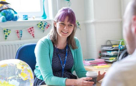 Teacher interviewing student