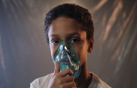 Boy with oxygen mask