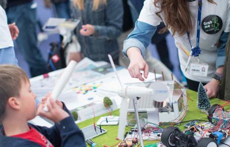 Demonstrators engaging with a child at Imperial Festival 2014