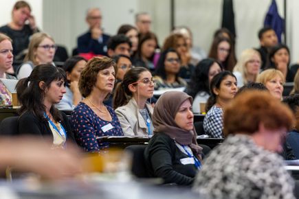 A photo of people at a conference
