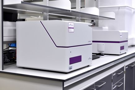 A photograph of two plate reader instruments supplied by BMG Labtech. One is a UV-vis photo-spectrometer and the other is a nephelometer