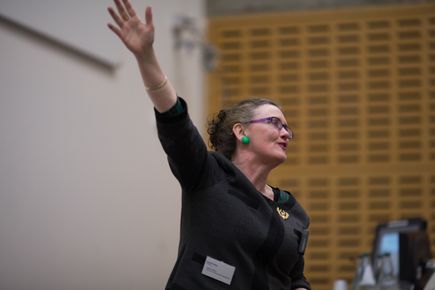 female staff giving a lecture