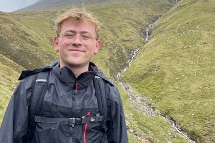portrait of PhD student representative Theo Brook