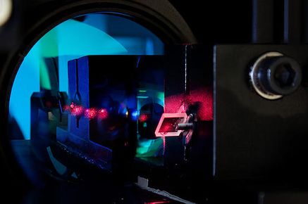 a tissuecycte microscope lit up in a dark lab