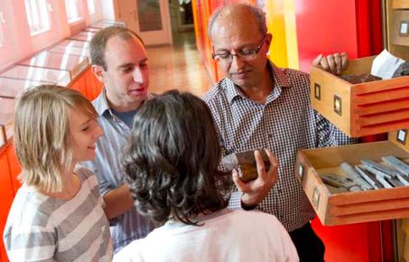 Students and lecturers discuss rocks