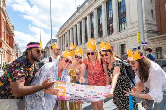 Guests at the Great Exhibition Road gather around a map