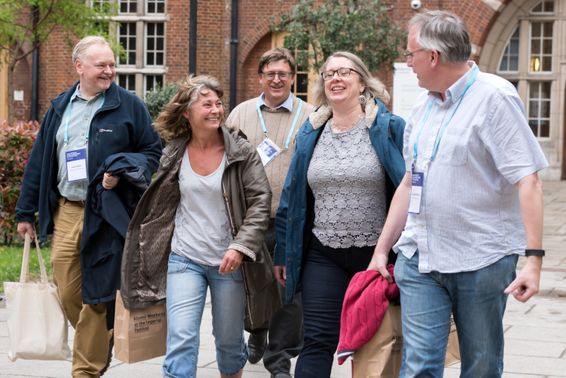 A group of alumni chat in Beit Quad at the Student Union