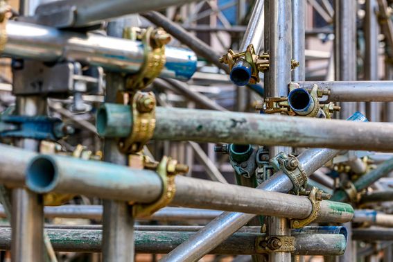 An artistic close-up view of the scaffolding surrounding the Queen's Tower