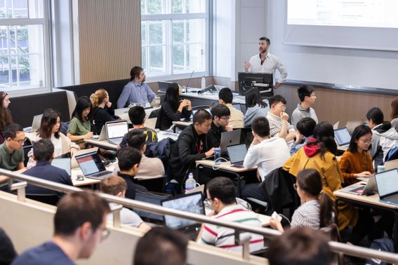 A group of students in an Applied Computational Science and Engineering lecture in the newly refurbished Royal School of Mines lecture theatre.