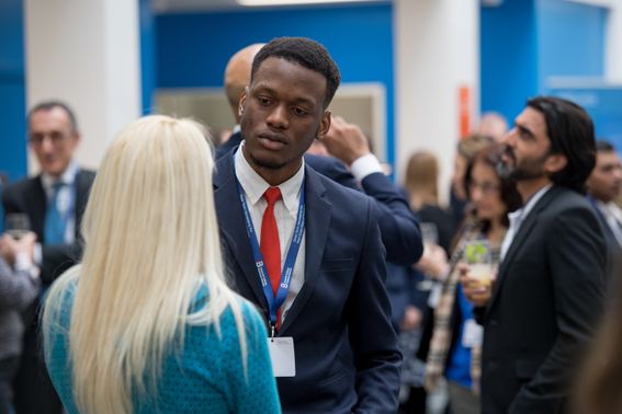 People engaged in a discussion at deep tech conference