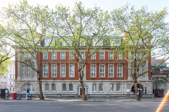 Old victorian building home to Dyson School of Design Engineering with trees in front