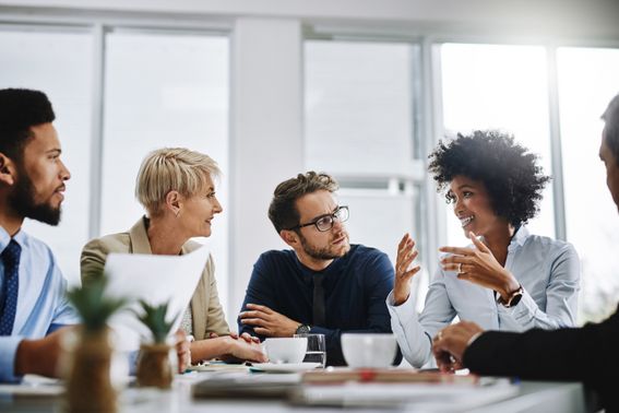 A picture of a group of people in a meeting