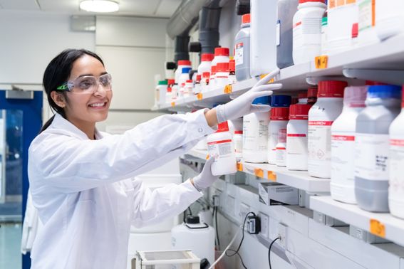 Scientist wearing a lab coat in a lab