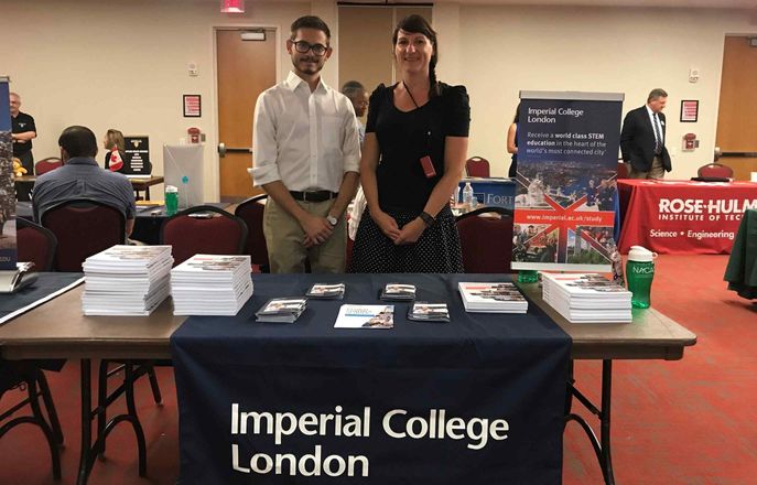 Male and female at student recruitment fair