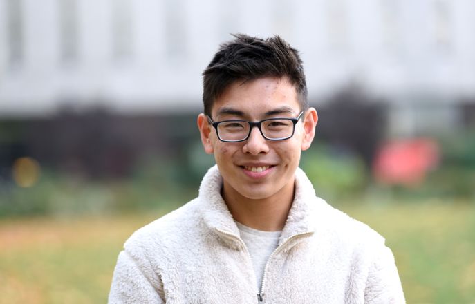 Student smiles at the camera