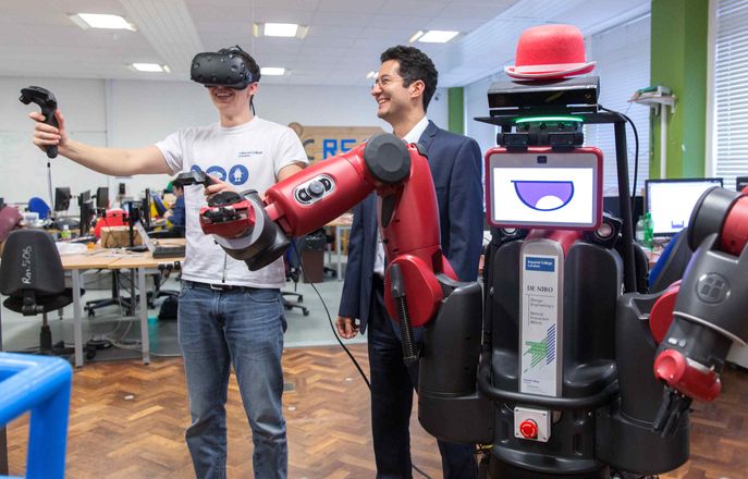 Design Engineering student with a robot