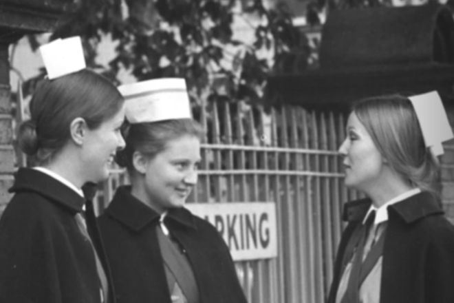 Three Nurses chat outside the gates of Hammersmith Hospital in 1970s