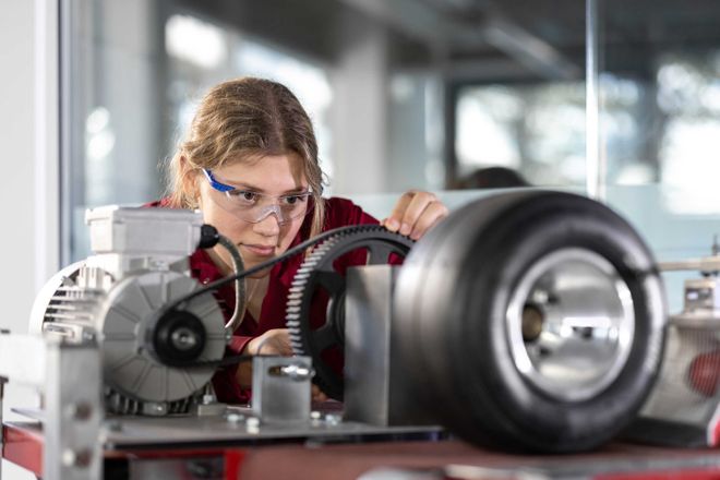 Scholar Michelle Kostin works on a car studying tyre particles emissions