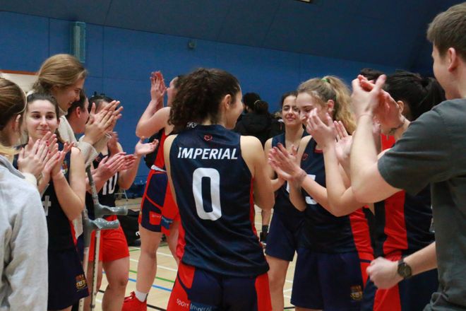 Students applauding after a match in Ethos Sports Hall