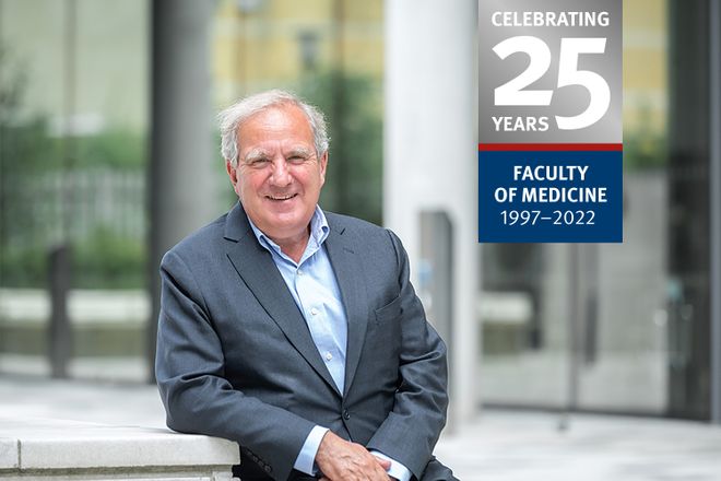 A photo of Professor Jonathan weber, with FoM 25 Anniversary logo