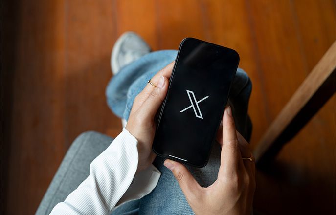 X app on phone display