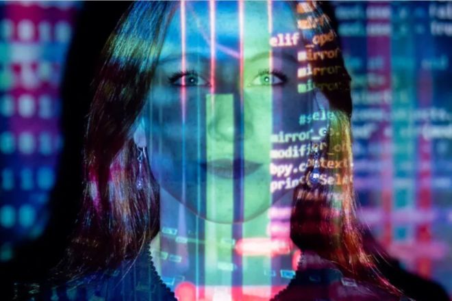 Woman with computer code projected on face