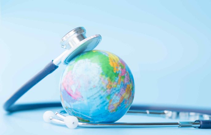 A globe and a stethoscope to represent global health