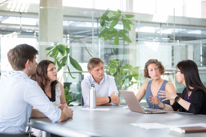 Group of people sitting around a table