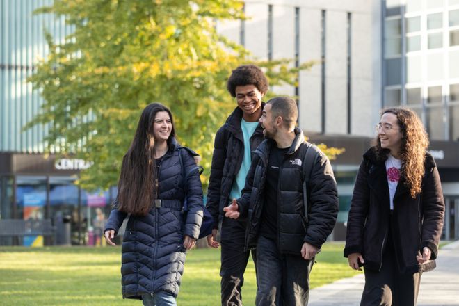 students walk around campus