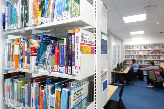 A photo of books in a library