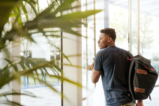 Student going through a door