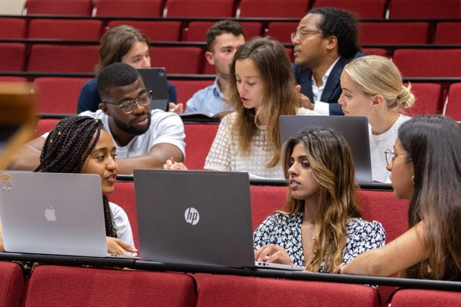 Students using laptops in a teaching space