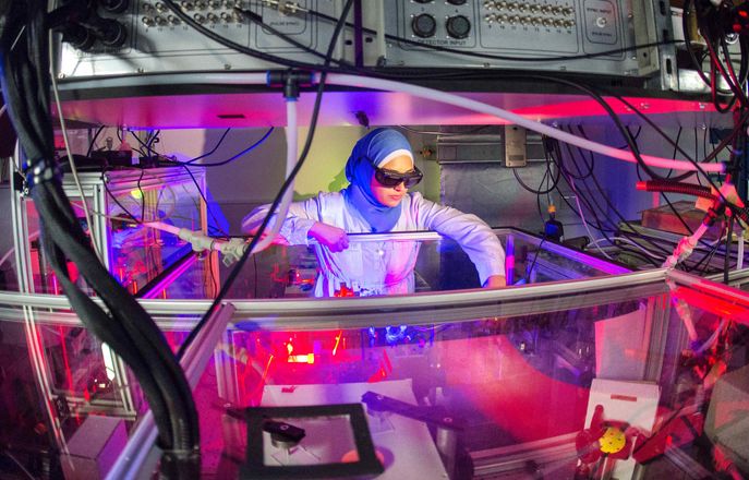 researcher uses machinery in lab