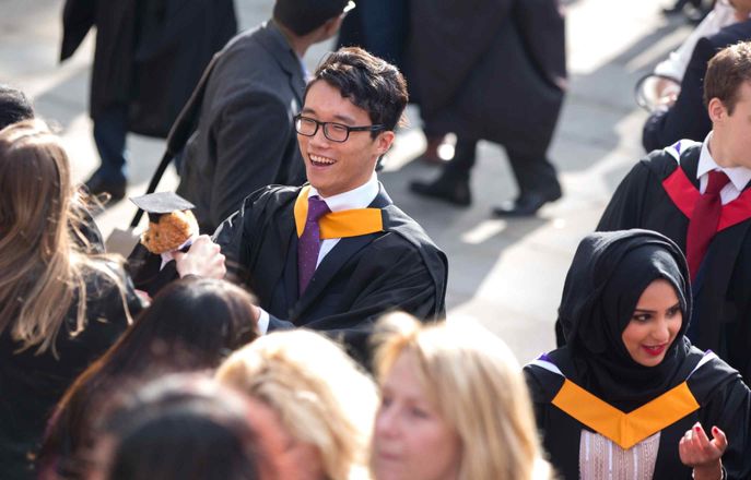 3 students await the presentation of their certificates at their graduation ceremony at the Royal Albert Hall